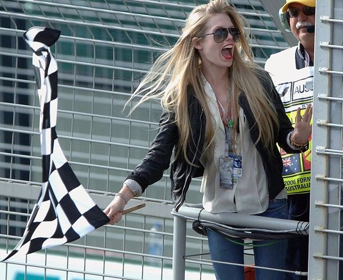 Theodora Richards waves the chequered flag 