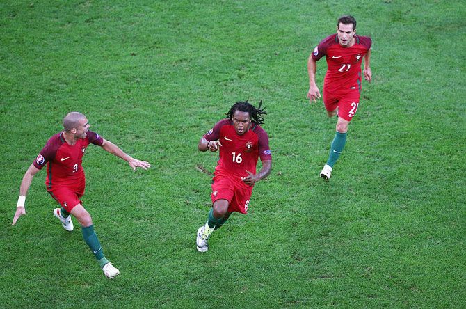 Portugal's Renato Sanches (centre) celebrates with his teammates Pepe (left) and Cedric Soares on scoring the equaliser against Poland