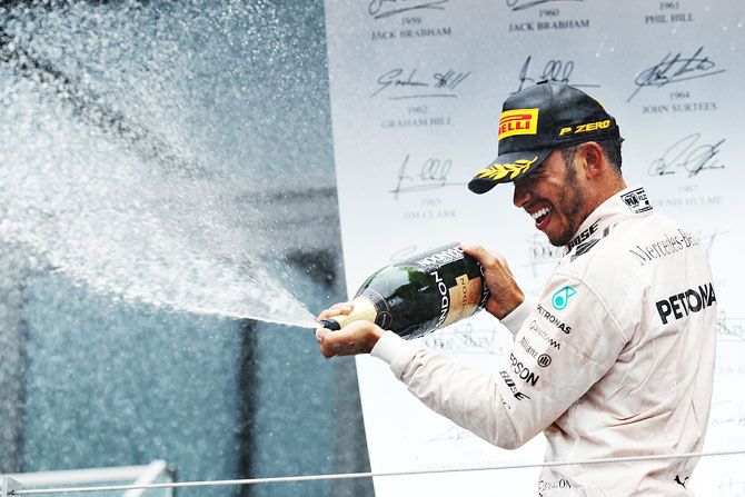 Great Britain and Mercedes GP's Lewis Hamilton celebrates on the podium after winning Austrian Formula One Grand Prix at Red Bull Ring in Spielberg, Austria, on Sunday