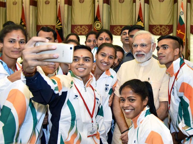 The Indian athletes click a selfie with Prime Minister Narendra Modi during the send-off ceremony organised for the Indian contingent for Rio Olympics 2016, in New Delhi, on July 4