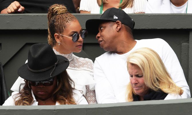 Singer Beyonce with her husband musician Jay Z with Serena Williams's family and friends in the Royal Box on centre court during the women's singles final on Saturday