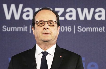 French President Francois Hollande speaks during a news conference at the NATO Summit in Warsaw, Poland, on Saturday