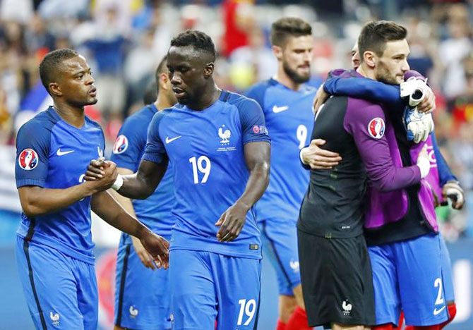 France's Bacary Sagna (centre), Patrice Evra and Hugo Lloris celebrate a win
