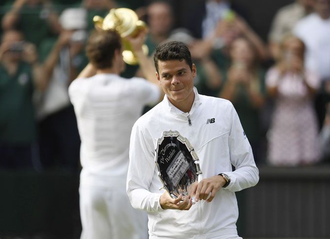 Canada's Milos Raonic with the Wimbledon runner-up trophy 
