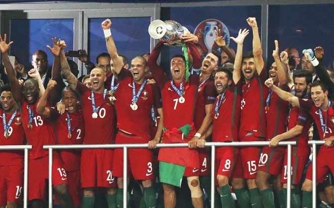 Portugal celebrates with the trophy after winning Euro 2016 at Stade de France in Paris on Sunday