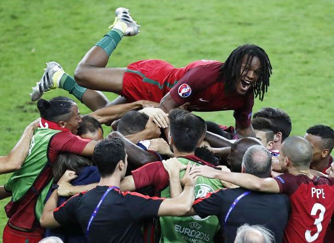Portugal's Renato Sanches and team mates celebrate the goal by Eder