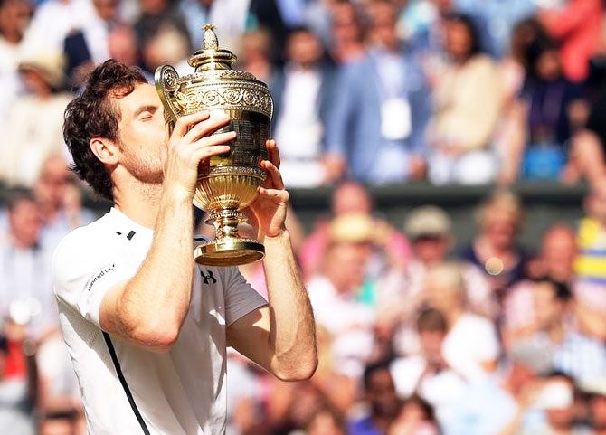 Great Britain's Andy Murray kisses the Wimbledon trophy