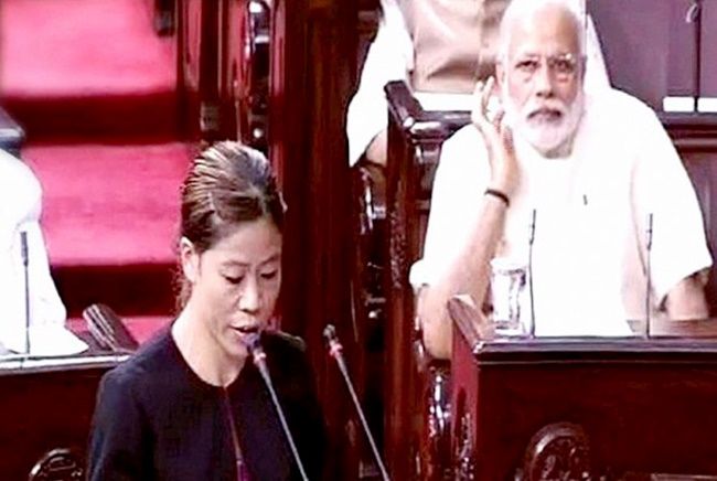 Champion boxer Mary Kom takes the oath as a member of the Rajya Sabha in April, 2016, as Prime Minister Narendra Modi watches