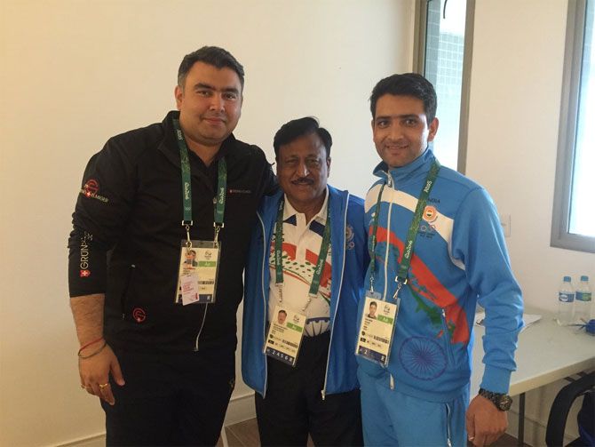 Indian shooters Gagan Narang (left), and Chain Singh (right) with India's Chef de Mission Rakesh Gupta at the Olympic Village in Rio de Janeiro