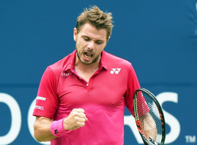 Stan Wawrinka reacts after winning a point against Kevin Anderson of South Africa on day five of the Rogers Cup tennis tournament at Aviva Centre on Friday