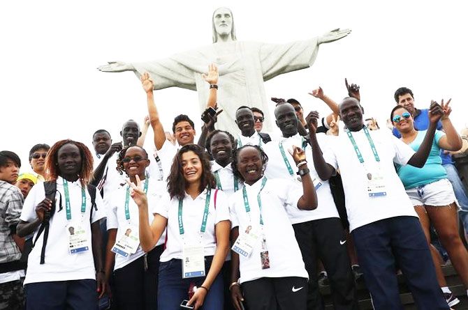  Members of the Olympic refugee team including Yusra Mardini from Syria (C) pose in front of Christ the Redeemer on Saturday