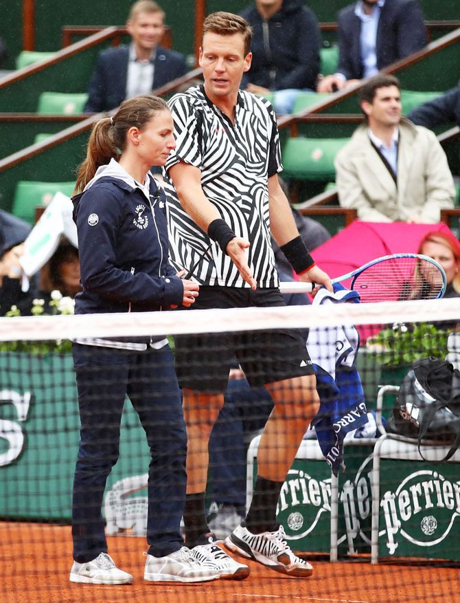 Tomas Berdych in a discussion with the match officials regarding weather conditions during his match against Novak Djokovic