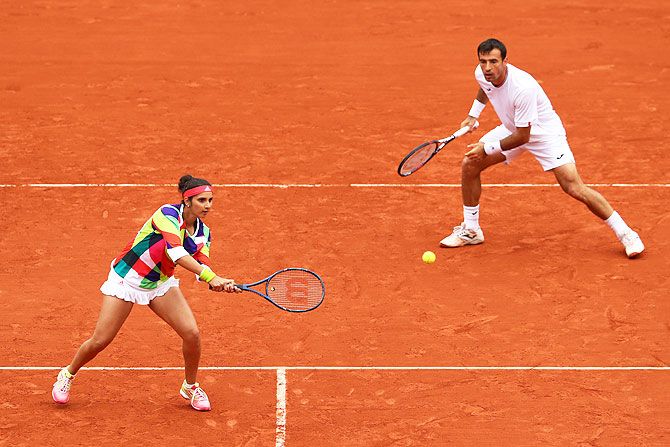 Sania Mirza and Ivan Dodig in action during the mixed doubles final