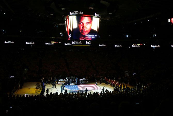 A moment of silence is held for the passing of Muhammad Ali prior to Game 2 of the 2016 NBA Finals between the Golden State Warriors and the Cleveland Cavaliers at ORACLE Arena in Oakland, California, on Sunday