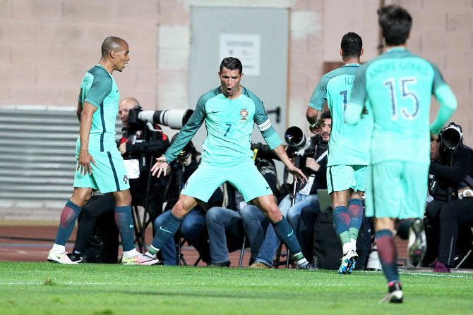 Portuguese's forward Cristiano Ronaldo celebrates scoring Portugal's goal