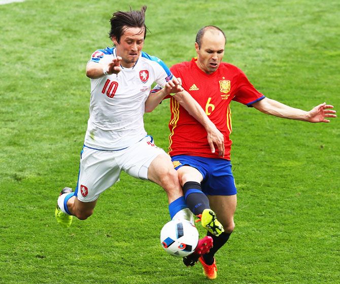 Czech Republic's Tomas Rosicky and Spain's Andres Iniesta vie for possession during their Euro 2016 Group D match in Toulose on Monday