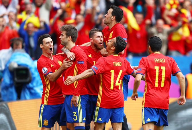 Spain's players celebrate Gerard Pique's (2nd from left) winning goal against Czech Republic during their Euro match on Monday