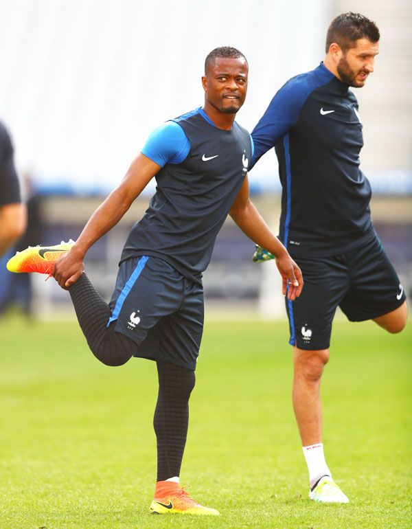 Patrice Evra warms up during a training session