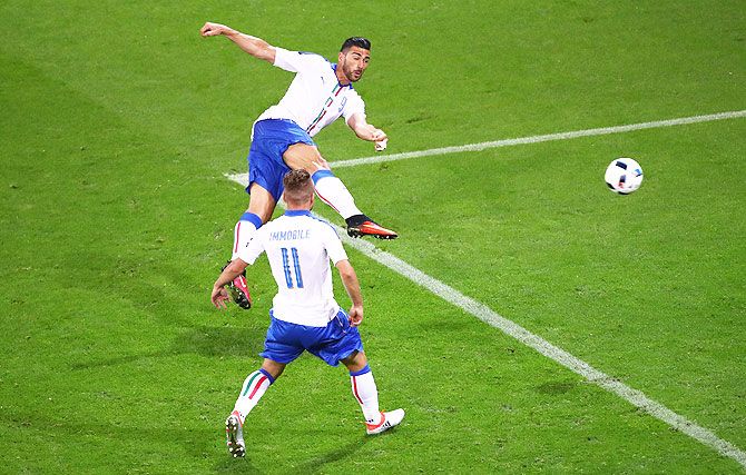 Italy's Graziano Pelle scores his team's second goal in added time