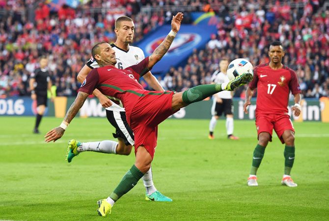 Portugal's Ricardo Quaresma stretches for the ball as he vies for possession
