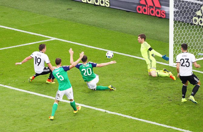 Germany's Mario Goetze (left) shoots on goal