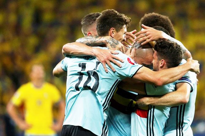 Belgium's Radja Nainggolan celebrates with team mates after scoring a goal against Sweden