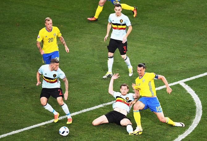 Sweden's Zlatan Ibrahimovic tries to break through the Belgium defence 
