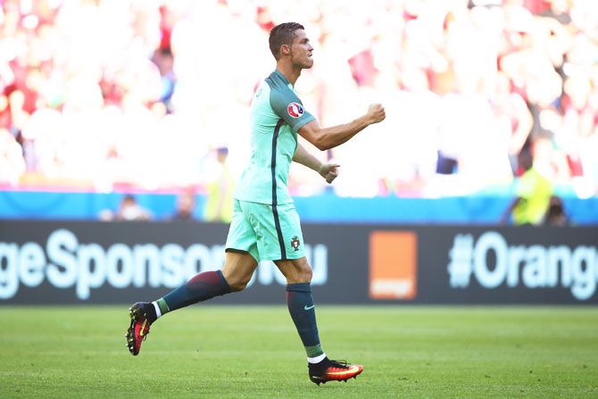 Portugal's Cristiano Ronaldo celebrates scoring his team's second goal against Hungary 