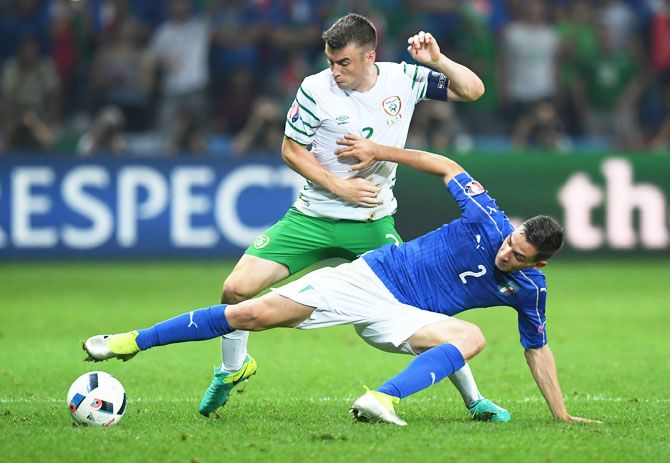 Republic of Ireland's Seamus Coleman and Italy's Mattia De Sciglio compete for the ball