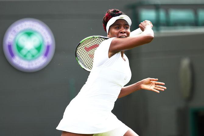 USA's Venus Williams plays a forehand shot shot during her first round match against Croatia's Donna Vekic