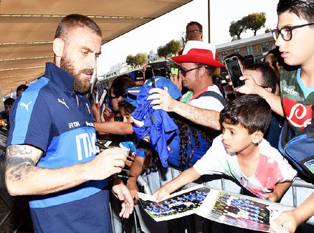 Italy's Daniele De Rossi signs autographs in Montpellier, France, on Wednesday