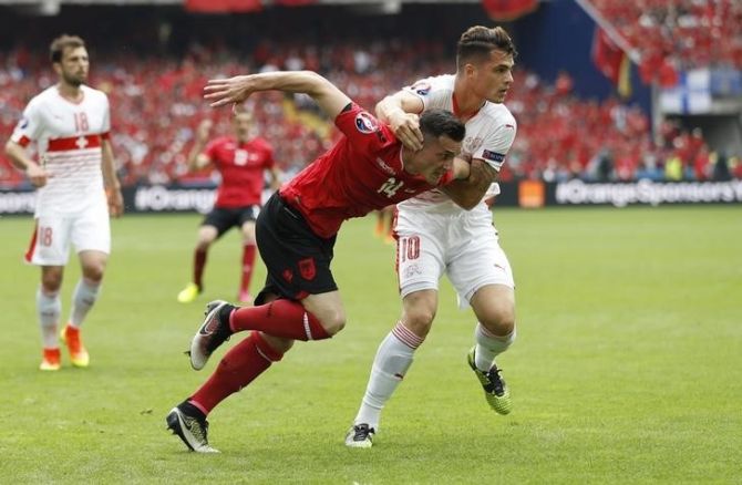 Switzerland's Granit Xhaka in action against brother Taulant Xhaka, who represented Albania during their Group A match in Lens on Saturday, June 11