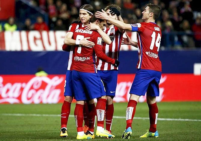 Atletico Madrid's players celebrate with Antonio's Griezmann after he netted the second goal against Real Sociedad