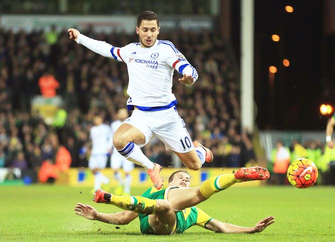 Chelsea's Eden Hazard is tackled by a Norwich City defender during their Barclays Premier League match at Carrow Road in Norwich on Tuesday