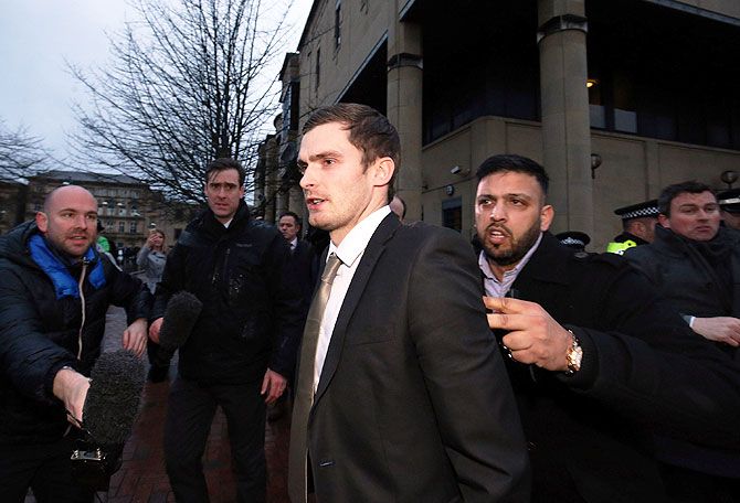 Footballer Adam Johnson leaves Bradford Crown Court on day fourteen of the trial where he was found guilty of one count of child sexual assault charges in Bradford, England, on Wednesday