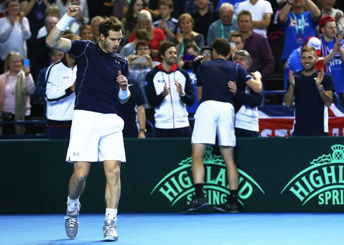 Great Britain's Andy Murray and Jamie Murray celebrate after their straight sets victory against Japan's Yasutaka Uchiyama and Yoshihito Nishioka in their doubles match on Day 2 of the Davis Cup World Group 1st round tie at Barclaycard Arena in Birmingham on Saturday
