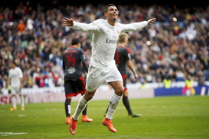 Real Madrid's Cristiano Ronaldo celebrates his fourth goal against Celta Vigo during their La Liga match at Santiago Bernabeu stadium, in Madrid on Saturday