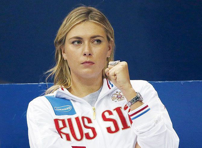 Russia's Maria Sharapova reacts as she watches compatriot Ekaterina Makarova play against Kiki Bertens of the Netherlands during their Fed Cup World Group tennis match in Moscow, on Sunday