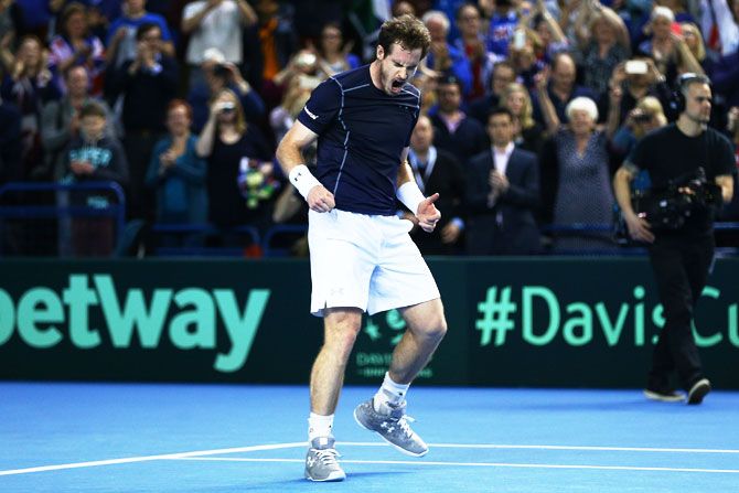 Great Britain's Andy Murray celebrates victory following the singles match against Japan's Kei Nishikori on day three of the Davis Cup World Group first round tie at the Barclaycard Arena in Birmingham, England, on Sunday