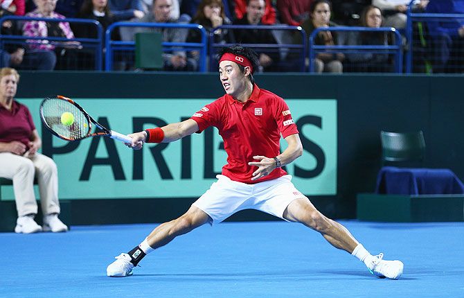 Japan's Kei Nishikori plays a forehand shot against Great Britain's Andy Murray