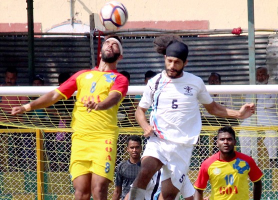 Players of Goa (in yellow) and Services in action during their Santosh Trophy semi-final in Nagpur  