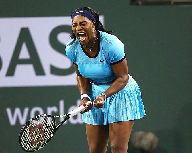 USA's Serena Williams celebrates a point in her match against Romania's Simona Halep