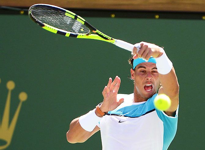 Rafael Nadal plays a forehand return during his quarter-final against Kei Nishikori