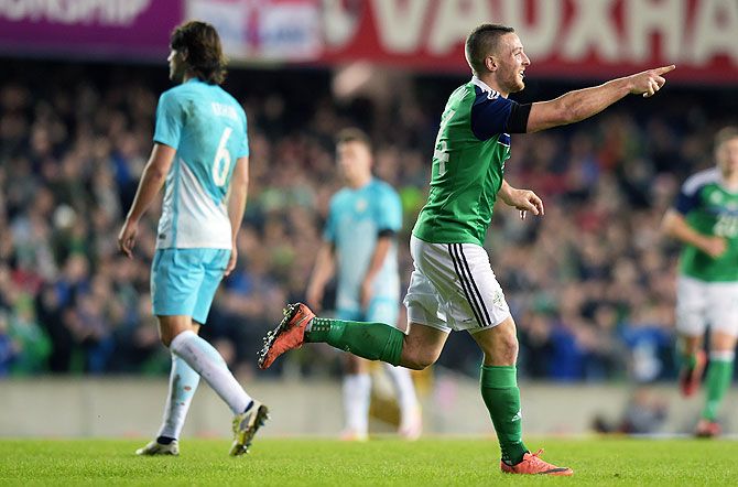 Northern Ireland's Conor Washington celebrates after scoring against Slovenia during an international friendly at Windsor Park in Belfast, on Monday