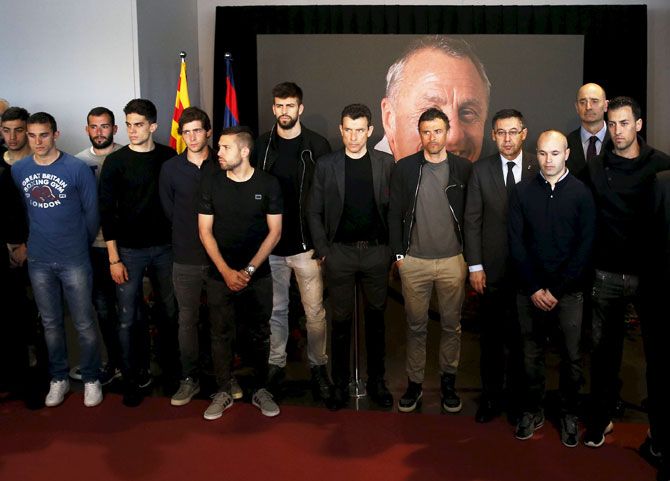 FC Barcelona's manager Luis Enrique along with players Andres Iniesta, Jordi Alba, Gerard Pique and Sergio Busquets attend a memorial service for Dutch soccer player late Johan Cruyff at Camp Nou stadium in Barcelona, on Tuesday
