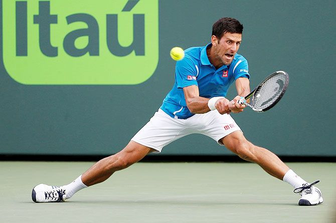 Novak Djokovic hits a backhand against Dominic Thiem (not pictured) during their fourth round match at the Miami Open at Crandon Park Tennis Center in Key Biscayne, Florida on Tuesday