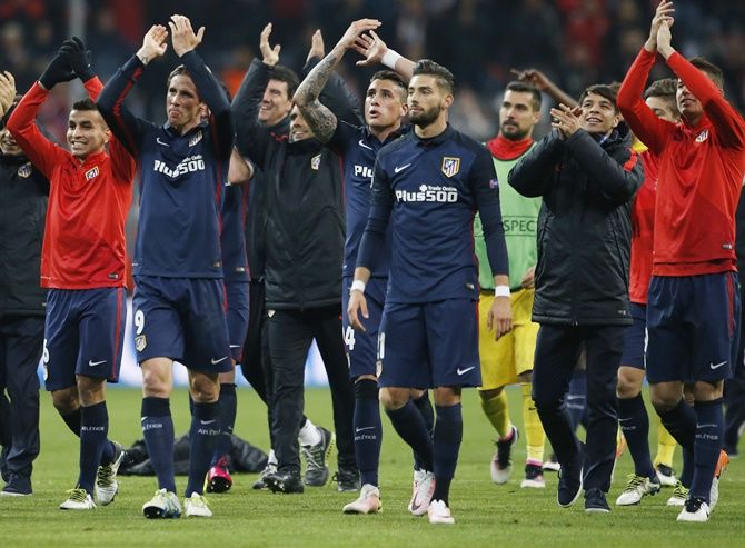 Atletico Madrid applaud fans after the game