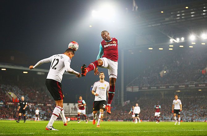 West Ham United's Diafra Sakho (right) and Manchester United's Chris Smalling battle for the ball