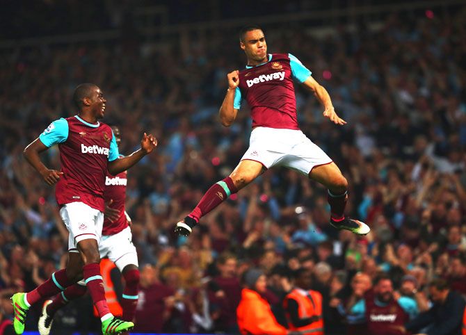 West Ham United's Winston Reid celebrates as he scores the winning goal against Manchester United during their Barclays Premier League match at the Boleyn Ground in London on Tuesday