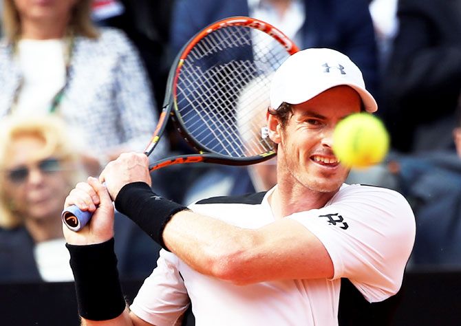 Andy Murray plays a return against David Goffin
